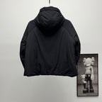 Back of black hooded puffer jacket with curved shoulders