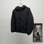 Black hooded puffer jacket, front view with zipper
