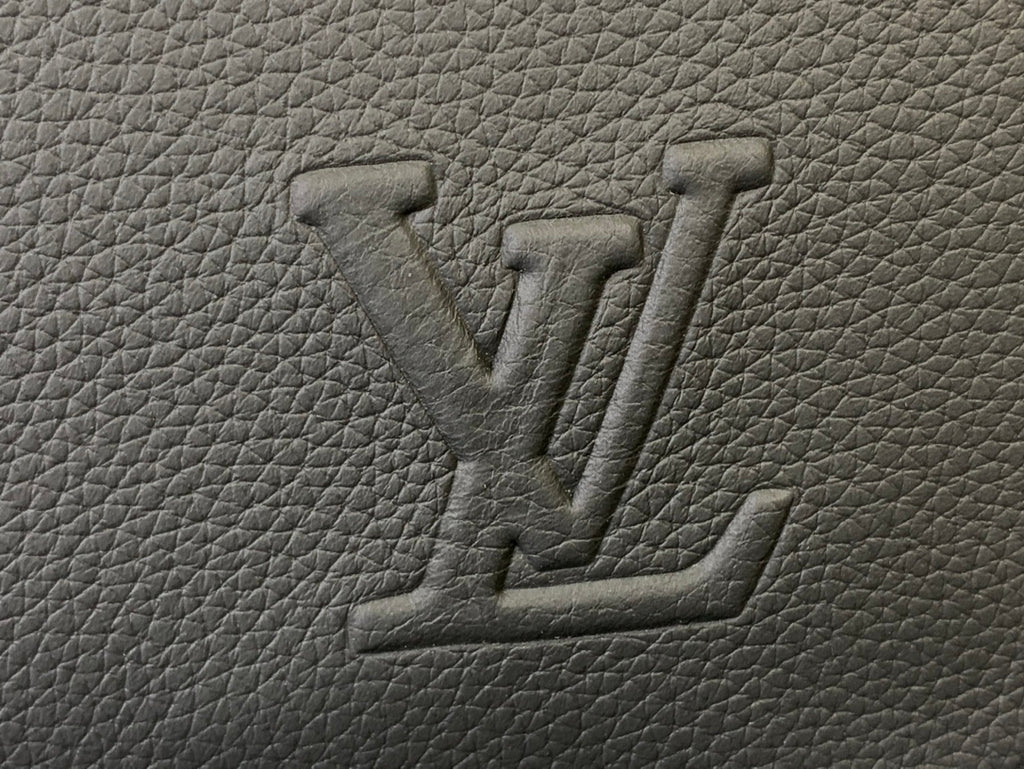 Embossed Louis Vuitton monogram on textured leather, close-up