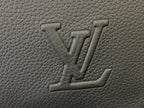 Embossed Louis Vuitton monogram on textured leather, close-up