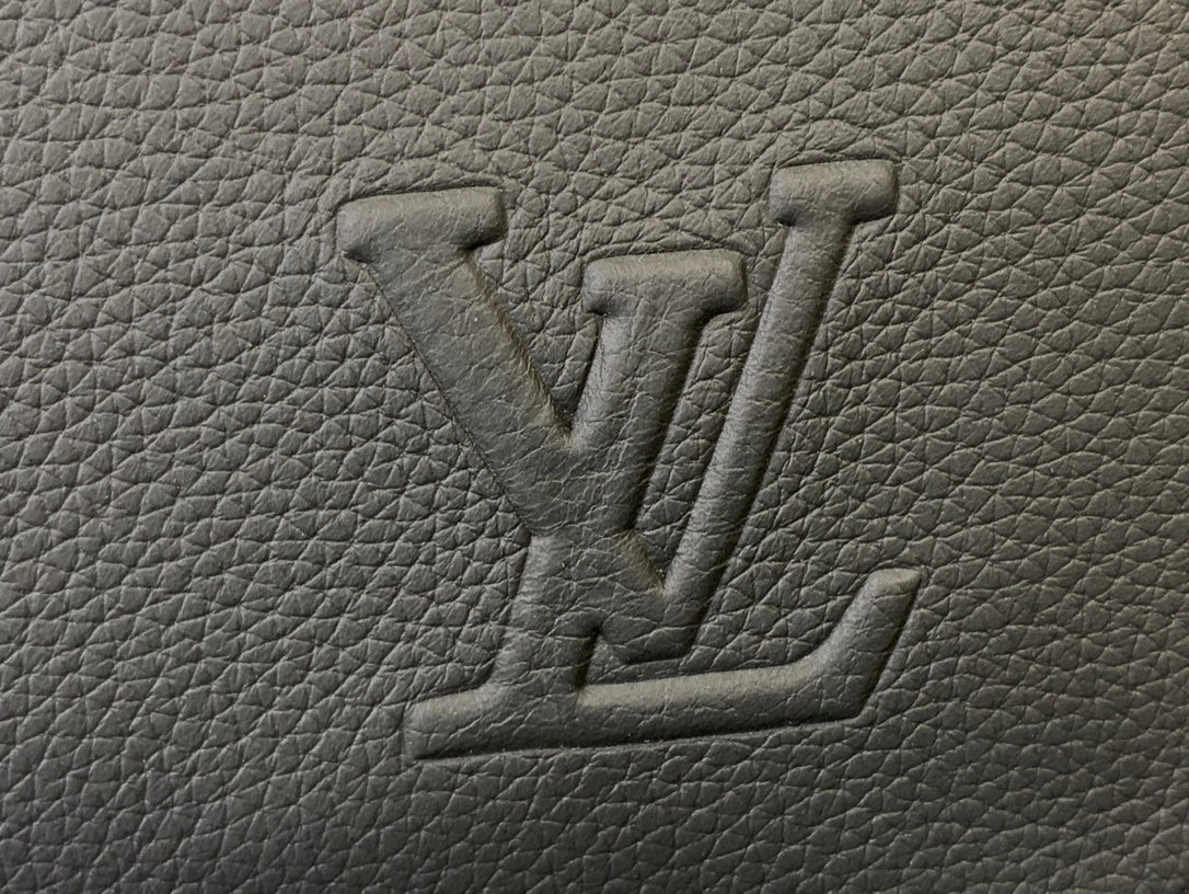 Embossed Louis Vuitton monogram on textured leather, close-up