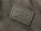 Louis Vuitton fabric label on bag lining, stitched label close-up