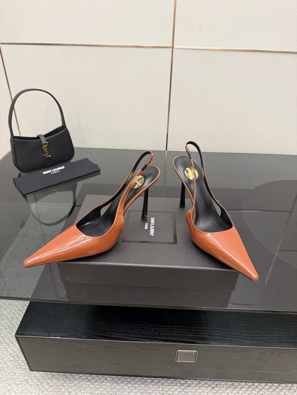Ladies' YSL two-tone orange-and-black pointed-toe pumps with stiletto heels, pair shown