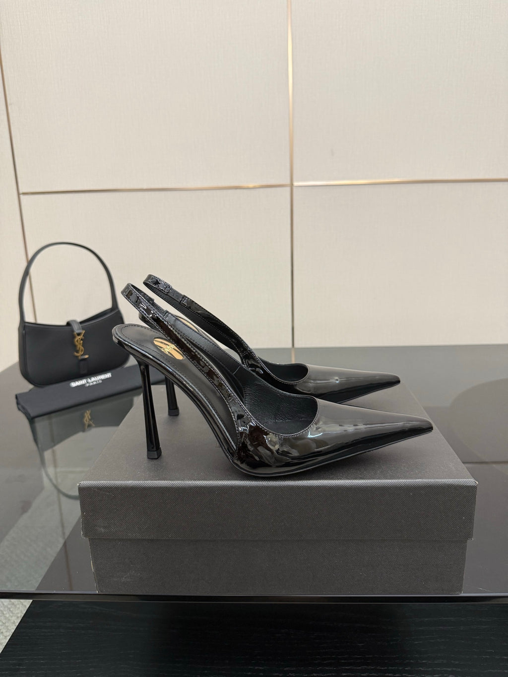 YSL women’s black pointed stiletto slingback heels, glossy side panels