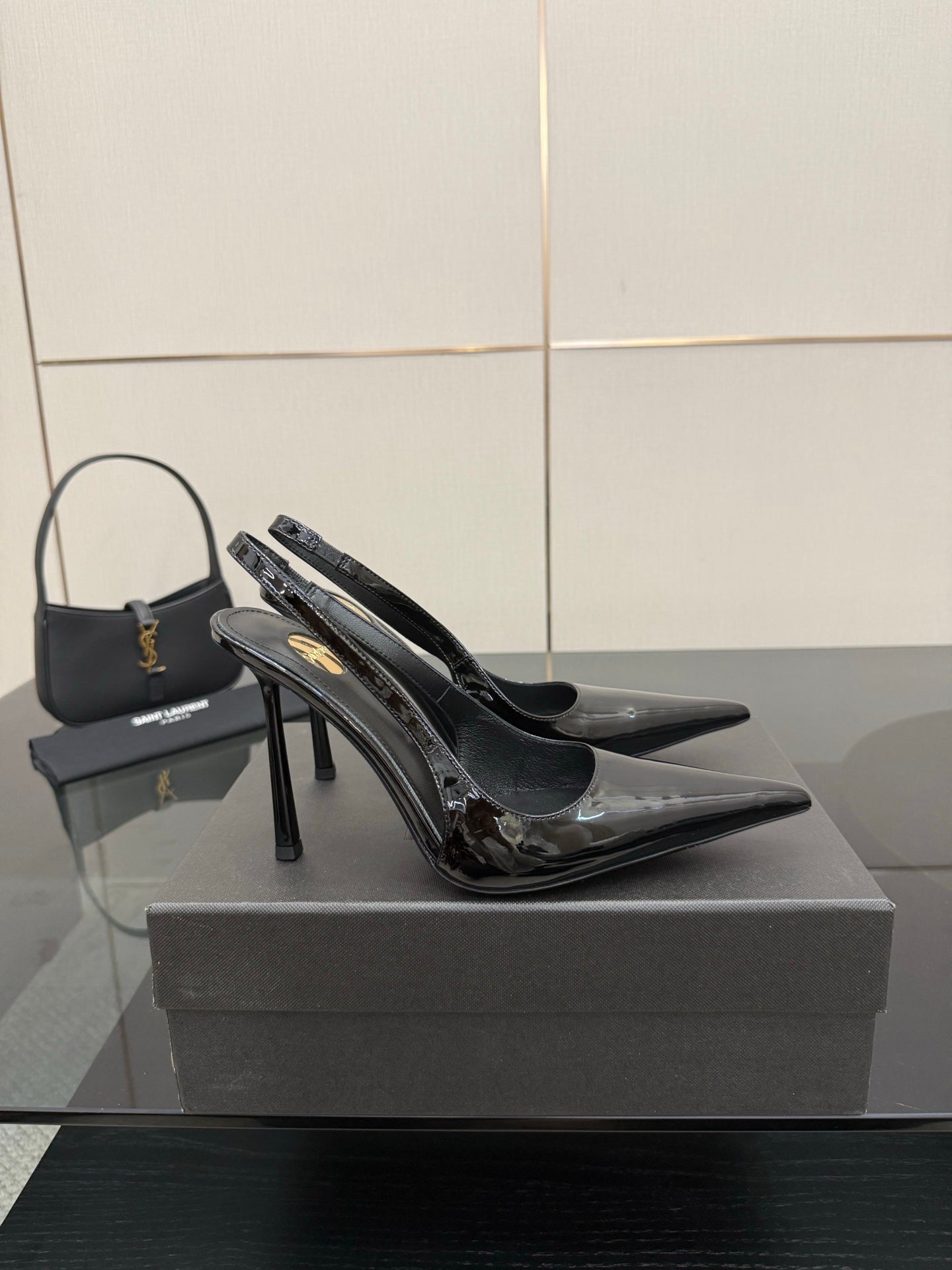YSL women’s black pointed stiletto slingback heels, glossy side panels