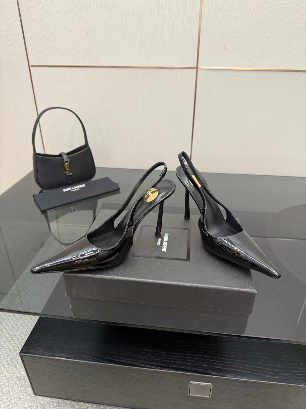 YSL women’s black slingback stiletto heels with glossy patent panels