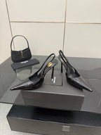 YSL women’s black slingback stiletto heels with glossy patent panels