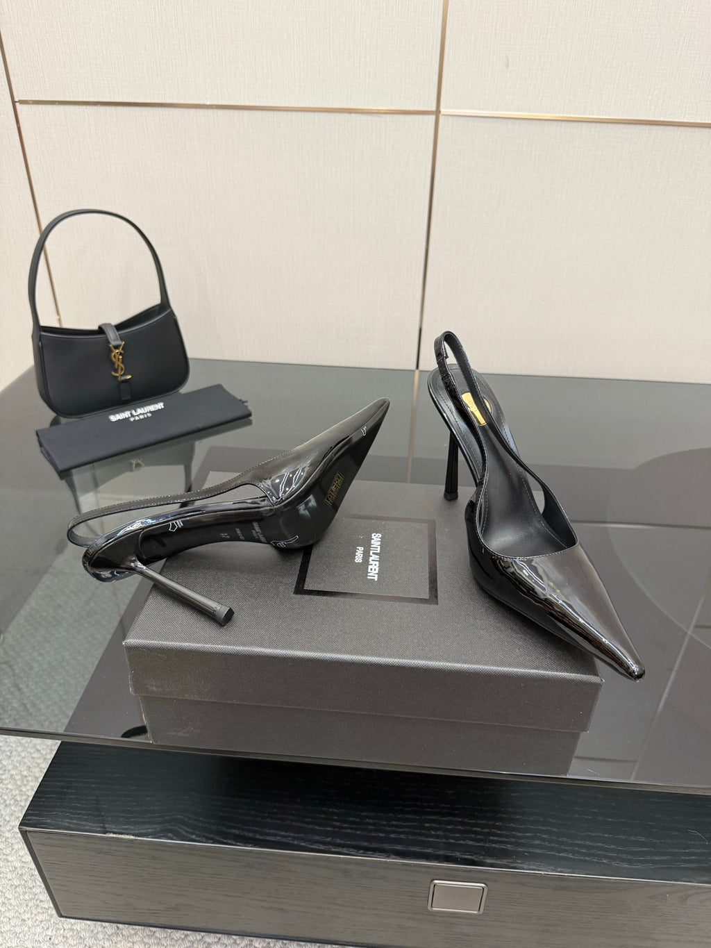YSL women’s black slingback stiletto heels with glossy toe and thin heel