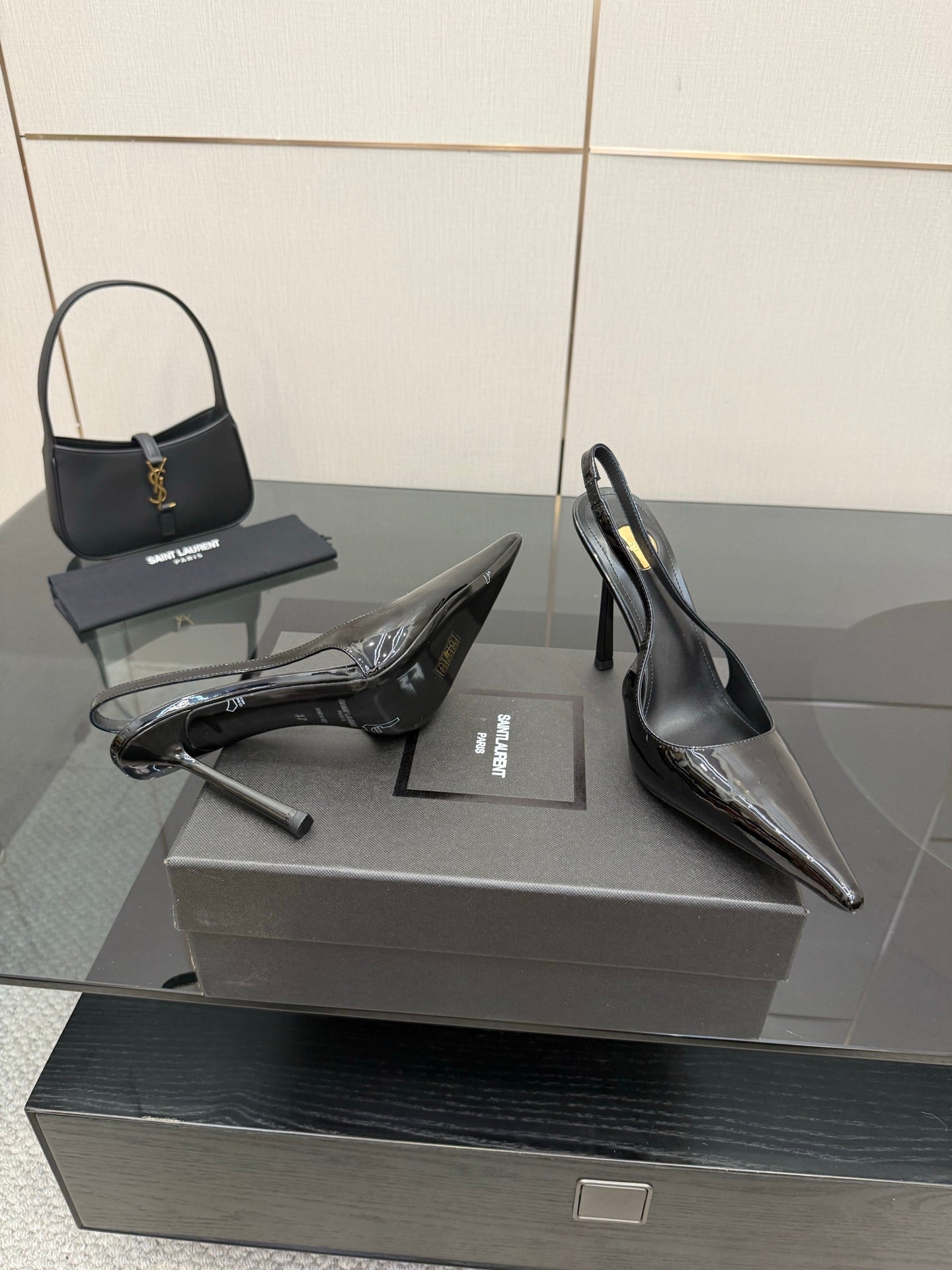 YSL women’s black slingback stiletto heels with glossy toe and thin heel