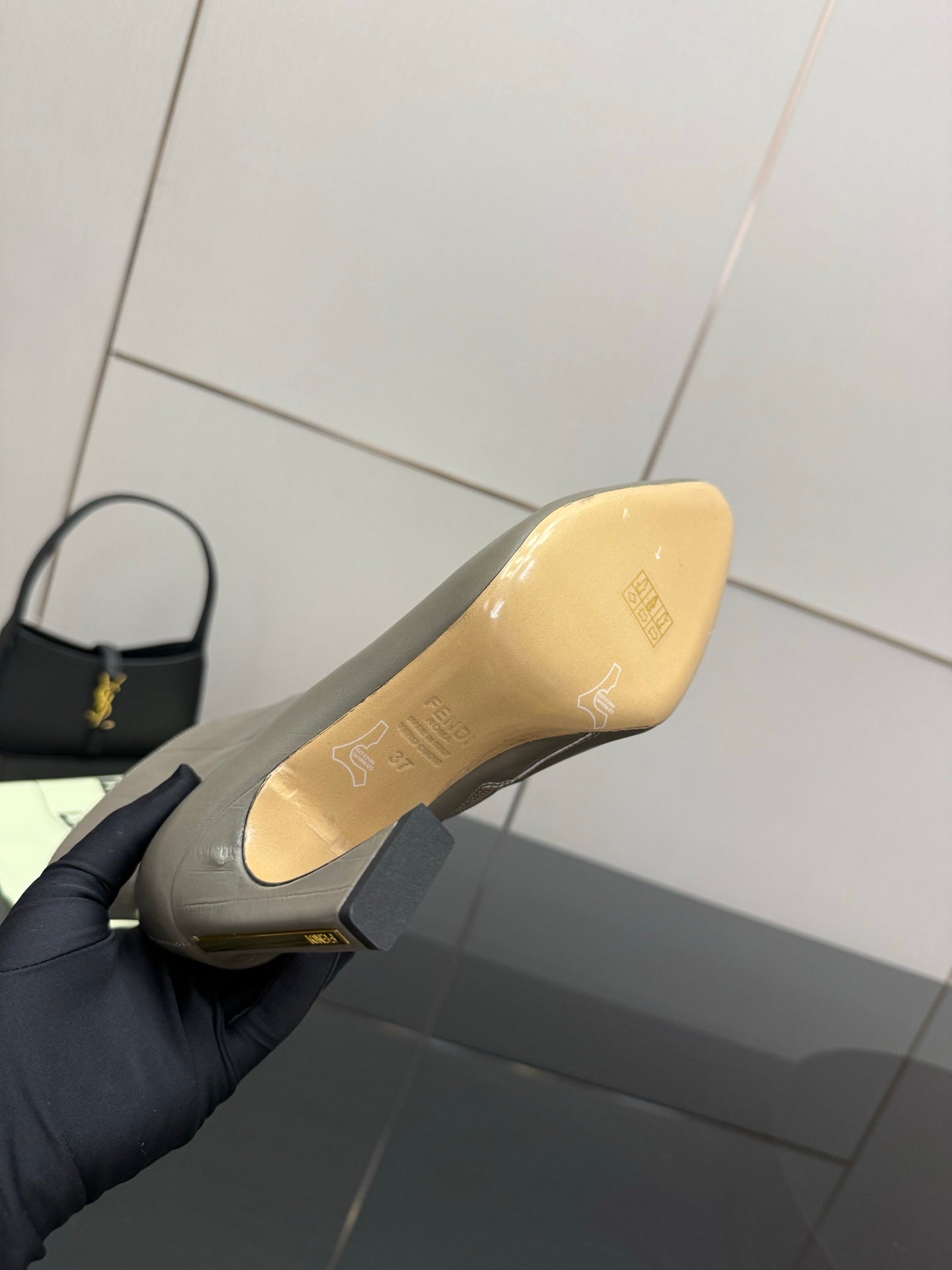 Fendi women’s ankle boot close-up, sole underside insole text, light beige outsole