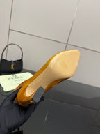 Tan leather ankle boot sole view with pointed toe and high heel