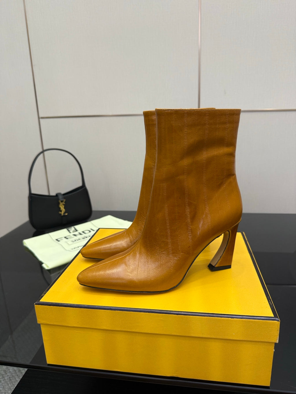 Tan leather pointed-toe ankle boot with high heel and side zip
