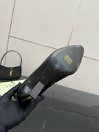 Black ankle boot sole and heel with printed logo and size markings