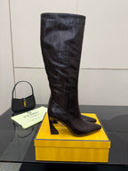 Single ladies dark leather knee-high boot with block heel and pointed toe