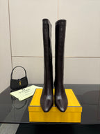 Ladies knee-high leather boots, dark with block heels and pointed toes
