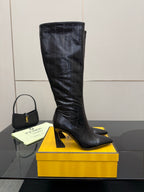 Dark knee-high heeled boots with sculpted stiletto heel and pointed toe