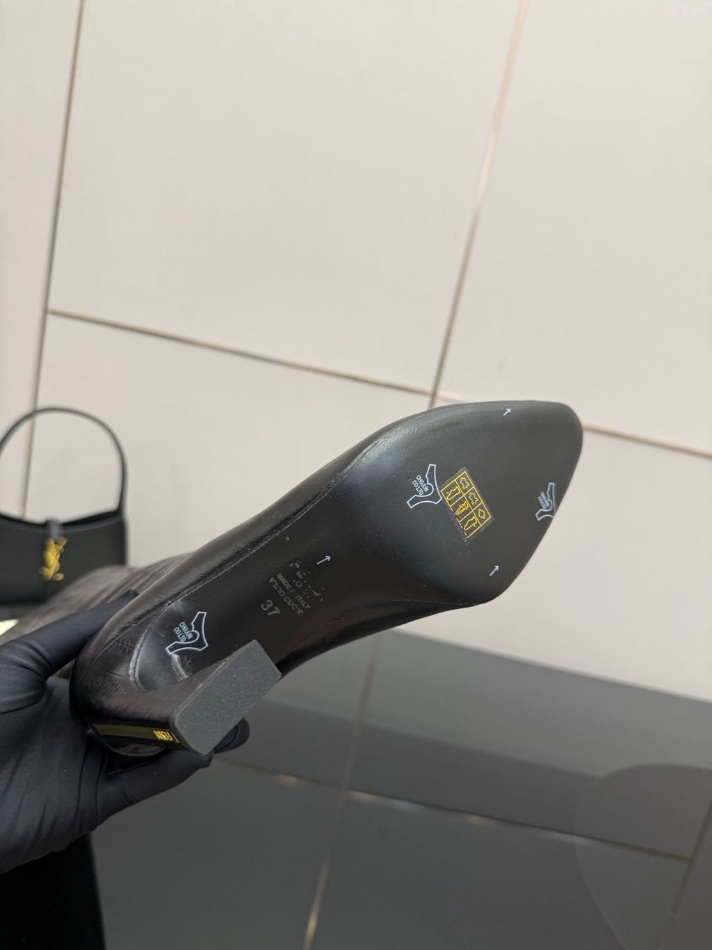 Dark boot toe area with logo markings on sole