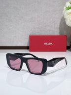 Prada sunglasses with black frame and pink tinted lenses