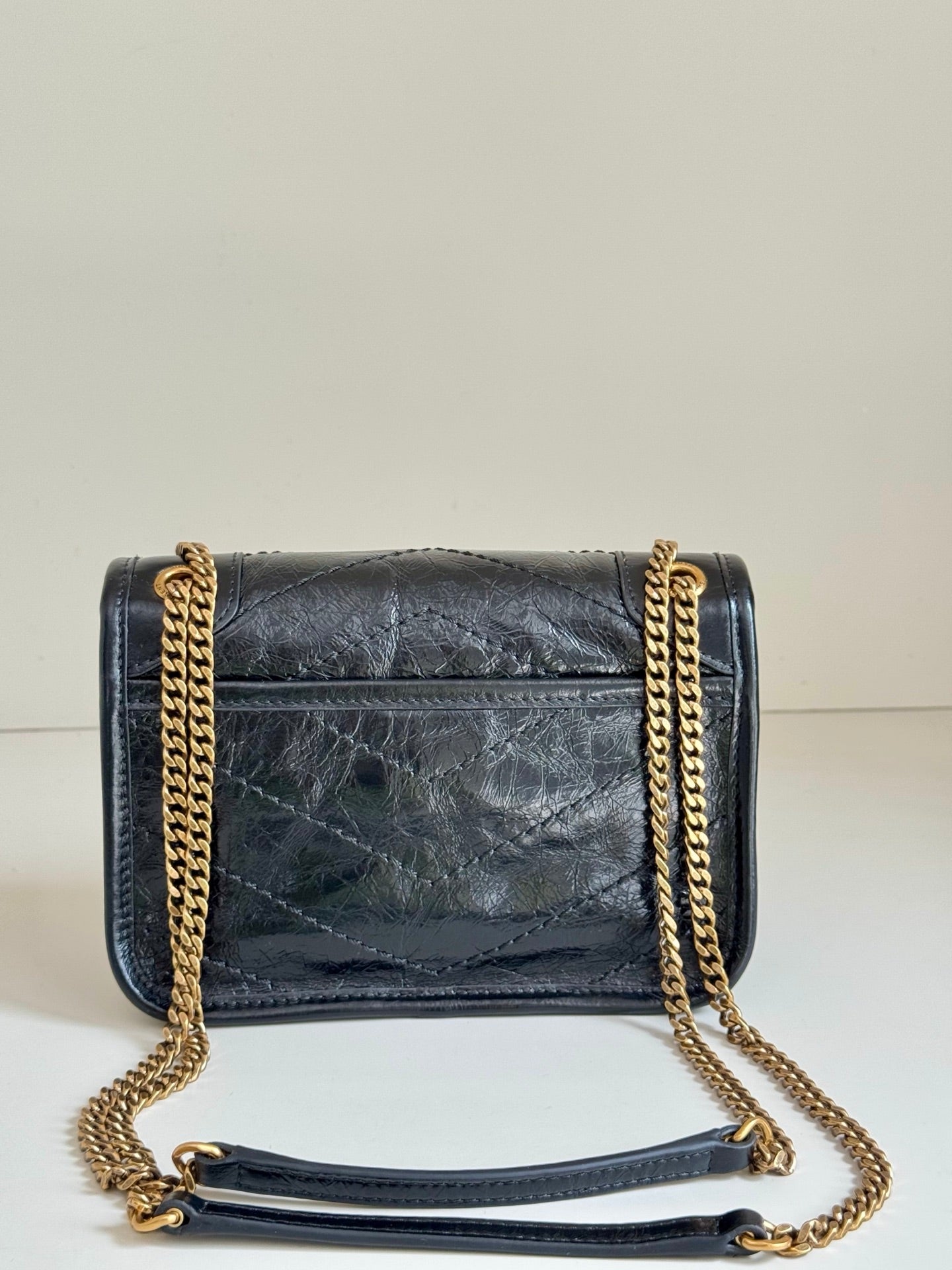 YSL dark leather shoulder bag with chain strap, front flap and gold hardware