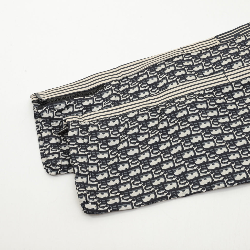 Dior monogram track pants folded, cream lining and striped side seams