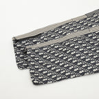 Dior monogram track pants folded, cream lining and striped side seams