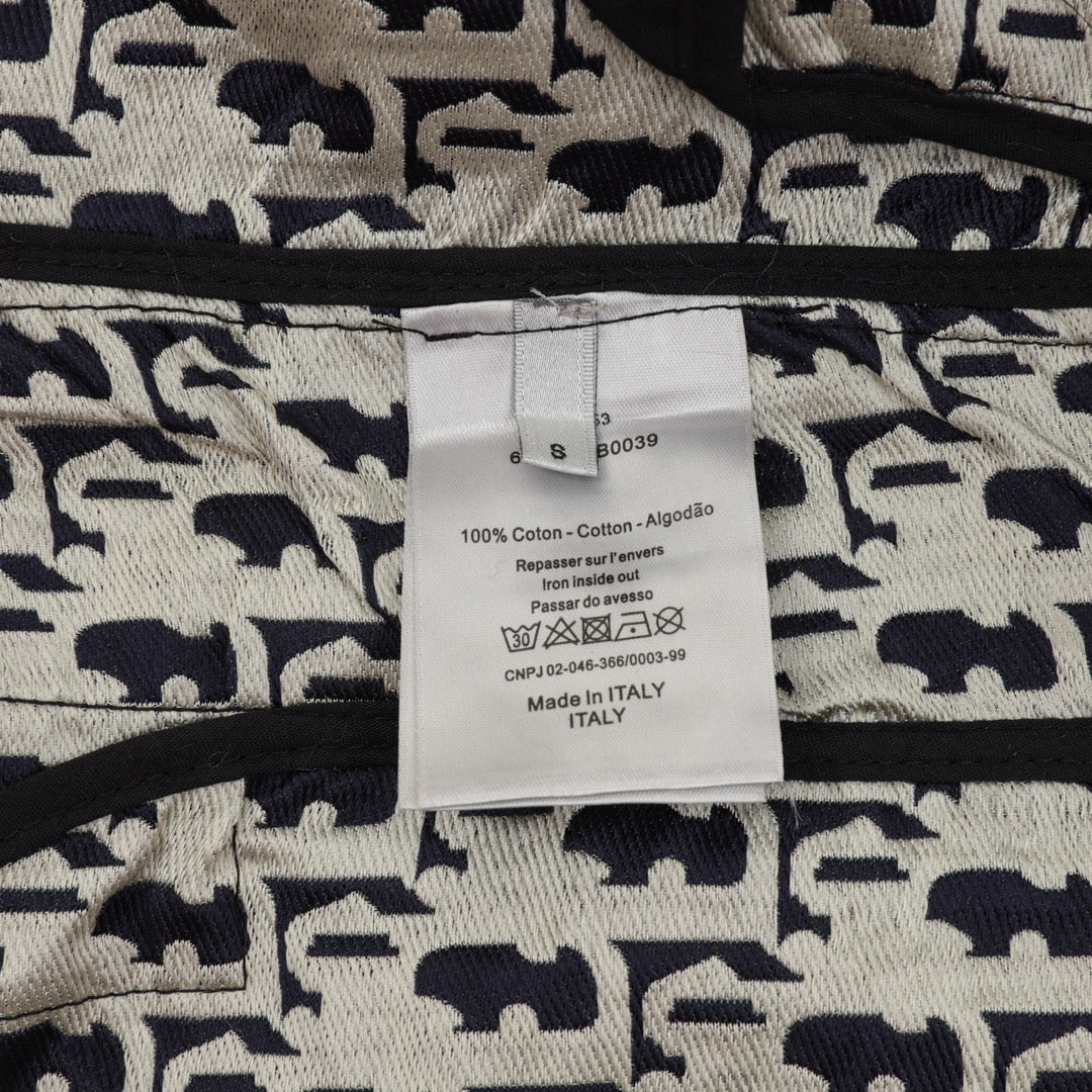 Cotton care label on Dior monogram track pants, Made in Italy