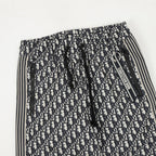 Dior monogram track pants, gathered elastic waistband, black-and-cream print