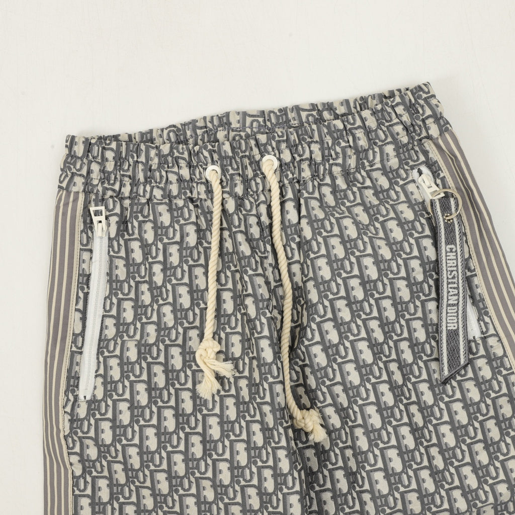 Dior monogram pants showing elastic waistband with drawstring and white toggles