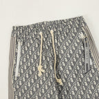 Dior monogram pants showing elastic waistband with drawstring and white toggles