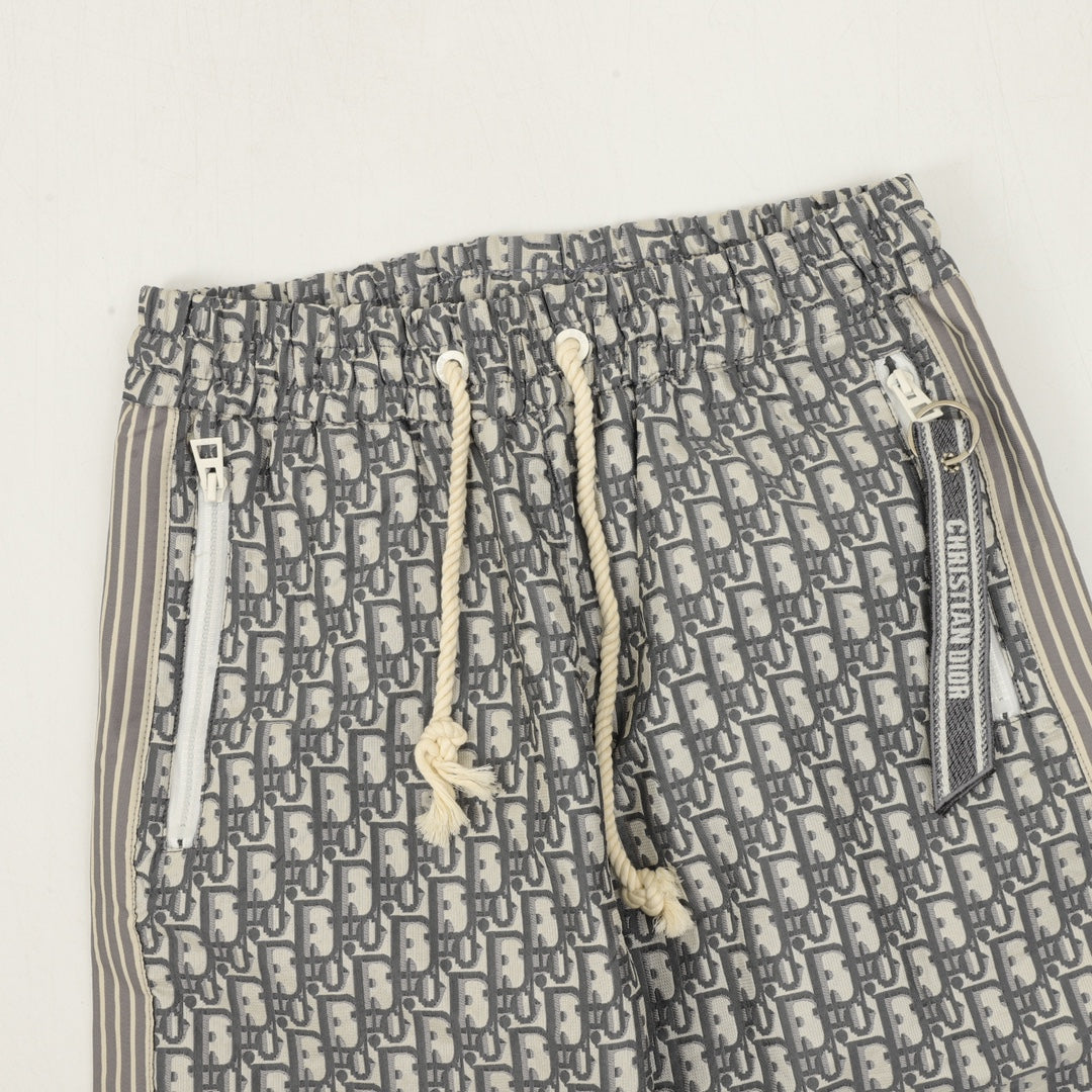 Dior monogram pants showing elastic waistband with drawstring and white toggles