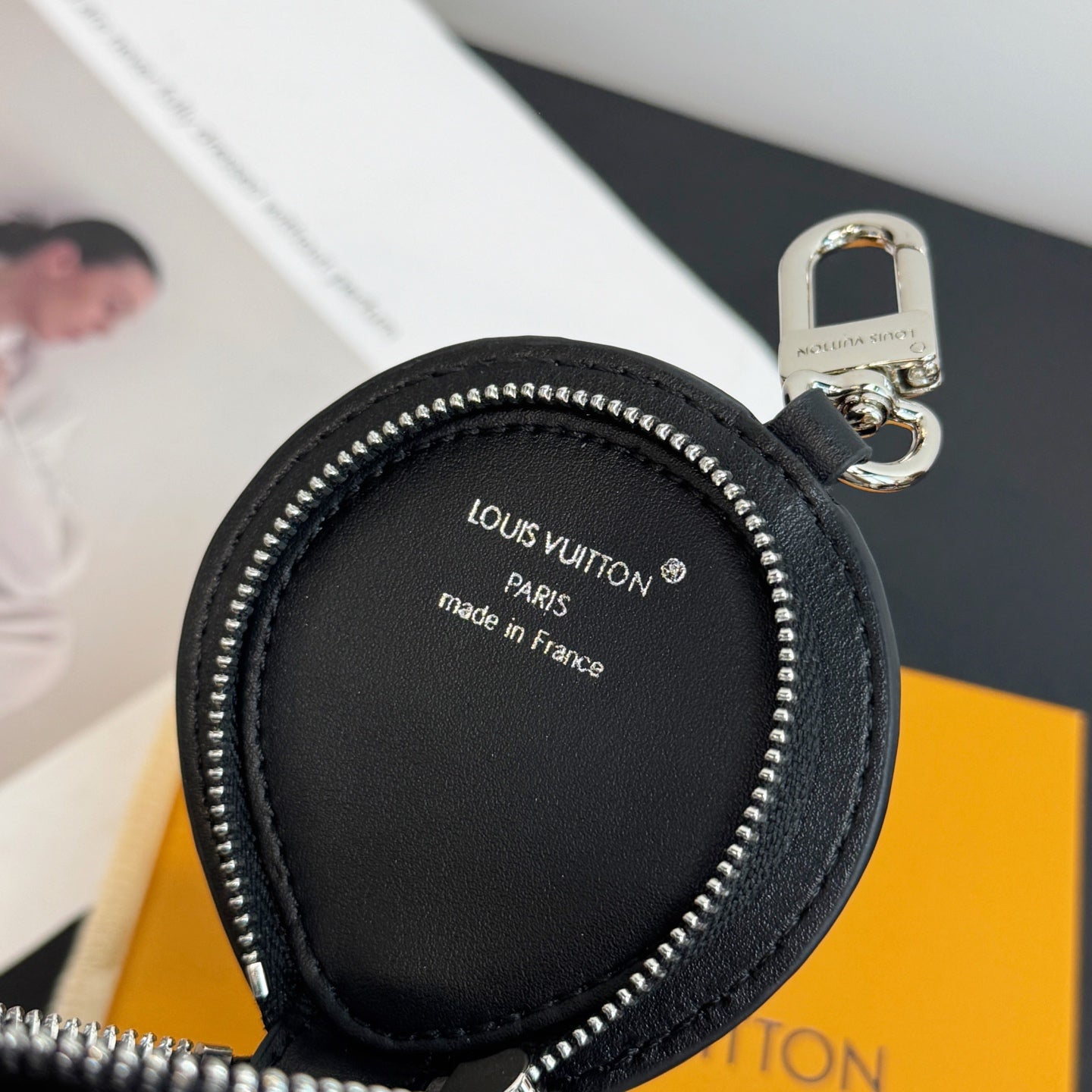 Louis Vuitton round leather zip pouch with Paris made in France label