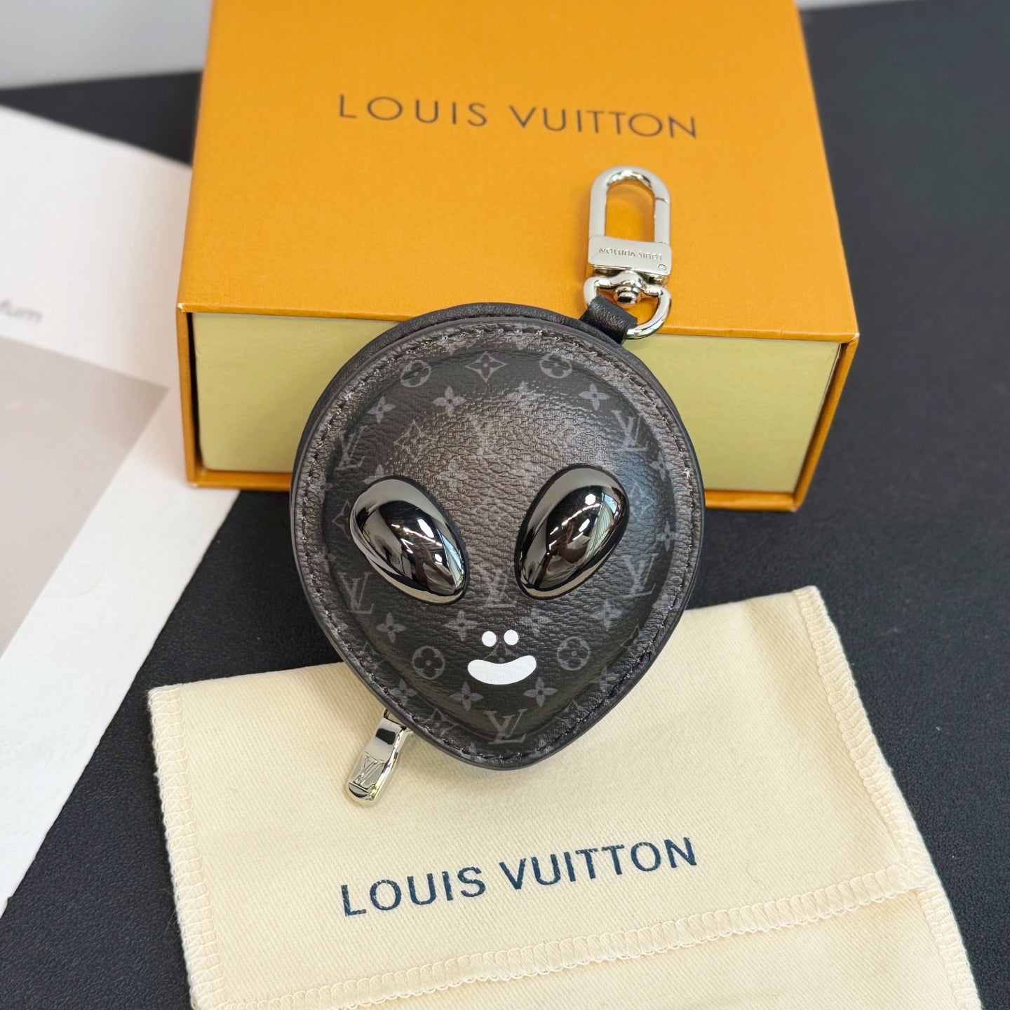 Louis Vuitton round zip key pouch with black monogram and cat face keyring