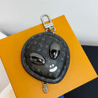 Louis Vuitton round zip key pouch with monogram print, cat face and metal clip