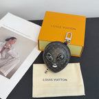 Louis Vuitton round zip key pouch with monogram, cat face, and included dust bag