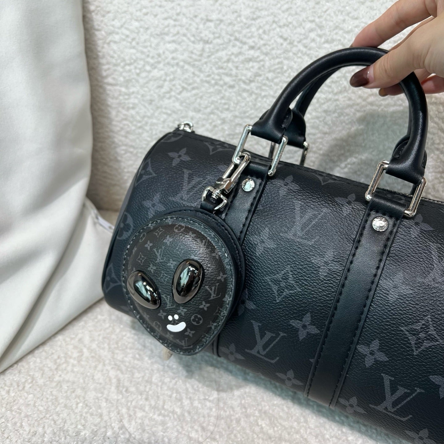 Louis Vuitton zip pouch with monogram canvas, black leather trim, and top handles