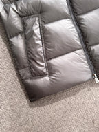 Gray quilted puffer jacket body with vertical seams and zipper placket