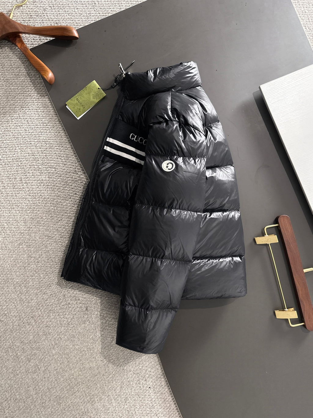 Gucci padded jacket in black with hood and logo stripe detail