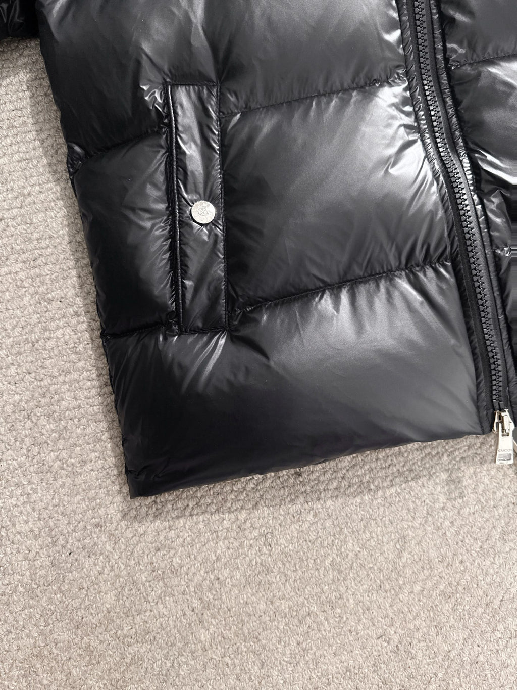 Gucci padded jacket in black with front button and side zipper seam
