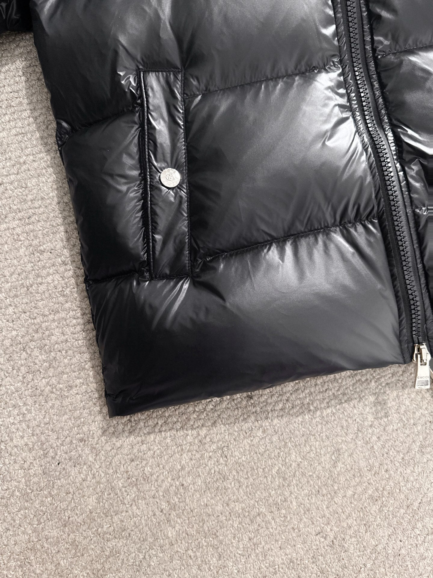 Gucci padded jacket in black with front button and side zipper seam