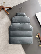 Dark gray long puffer vest with stand collar and horizontal quilted panels