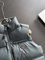Dark gray puffer vest collar with front zipper and Prada triangular chest patch