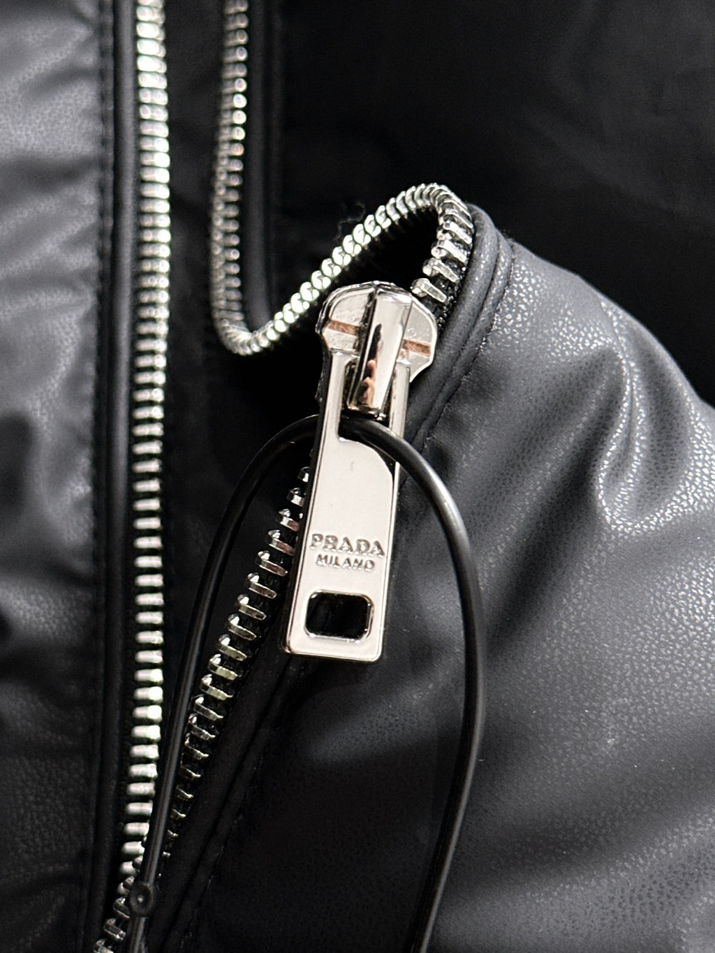 Prada black puffer vest zipper pull with metal ring