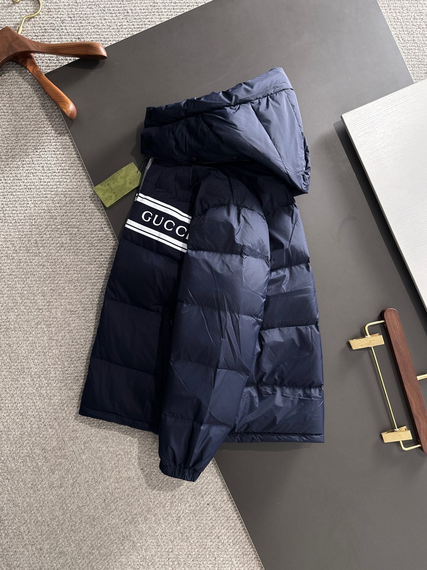 Gucci puffer jacket with hood, navy blue, front zipper and striped band