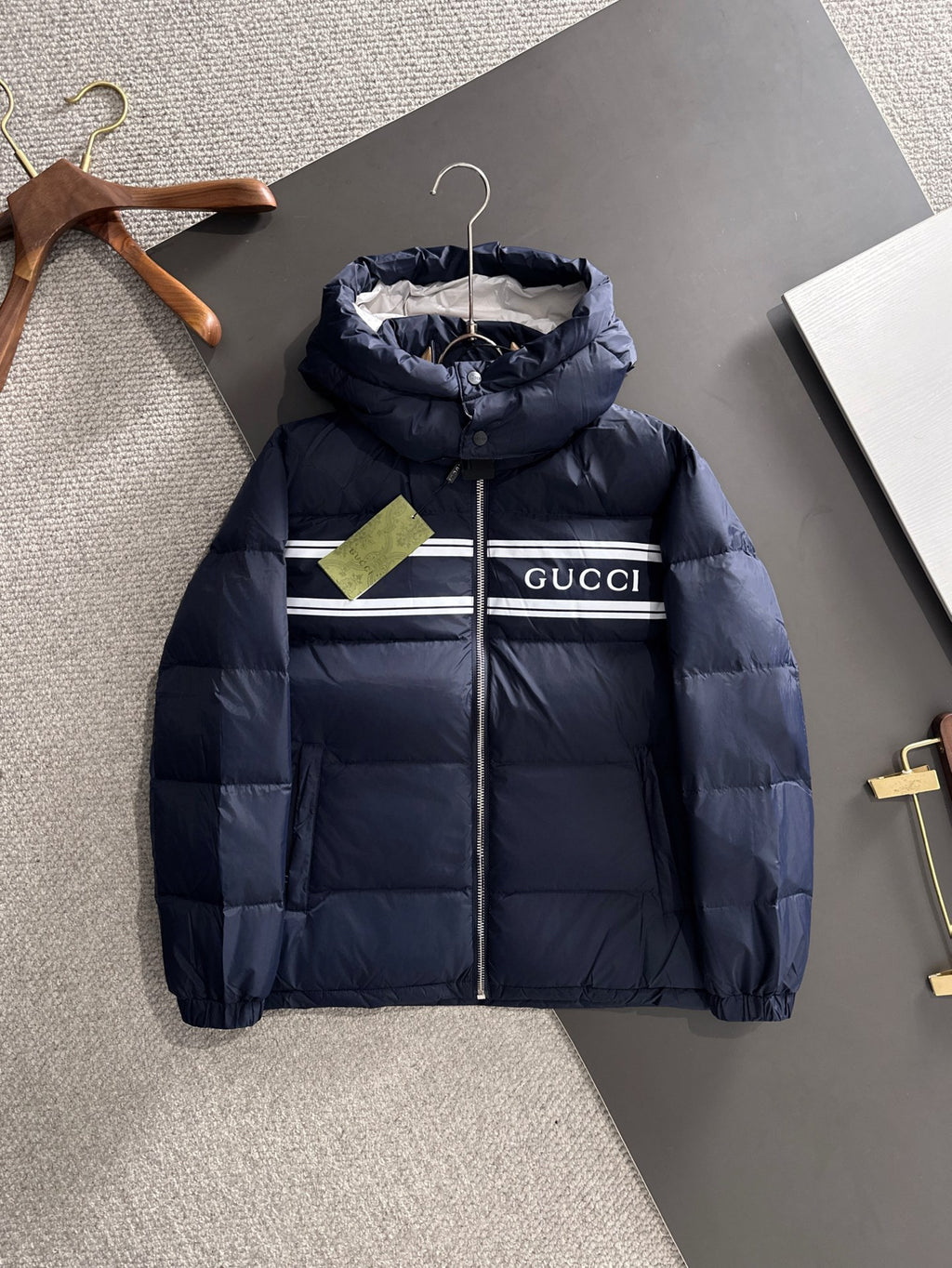 Gucci puffer jacket with hood, navy blue, front zipper and striped chest detail