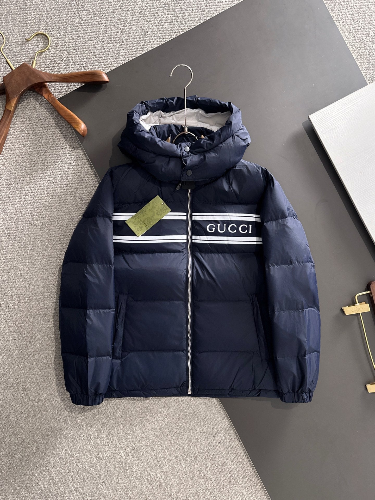 Gucci puffer jacket with hood, navy blue, front zipper and striped chest detail
