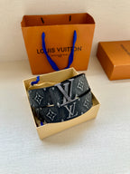 Monogram belt in gift box, dark patterned strap with gold-tone LV buckle