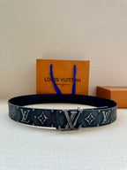 Louis Vuitton monogram belt with dark strap and gold-tone LV buckle