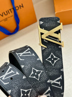 Louis Vuitton belt end and buckle close-up on dark monogram leather