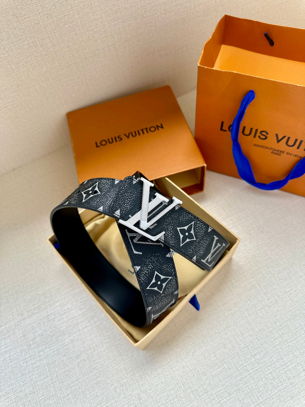 Louis Vuitton monogram belt in box, dark strap with gold-tone LV buckle