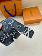 Louis Vuitton belt close-up with dark monogram leather and silver-tone buckle